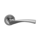 SB1301DT - Spira Brass Mercury Lever Handle on Round Rose - Dual Tone