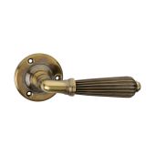 SB1107AB - Spira Brass Regency Lever Handle on Round Rose - Aged Brass
