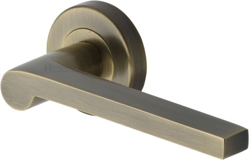 Click Here To Enlarge This Photo Of V6225-AT Heritage Brass Door Handle Lever Latch on Round Rose Metro Mid Century Design Antique Brass finish