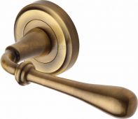 V7155-AT Heritage Brass Door Handle Lever Latch on Round Rose Roma Design Antique Brass Finish