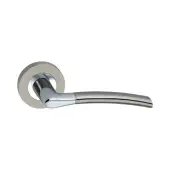 SB1310DT - Spira Brass Slavia Lever Handle on Round Rose - Dual Tone