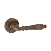 SB1110AT - Spira Brass Hazel Hammered Lever Handle on Round Rose - Antique Brass