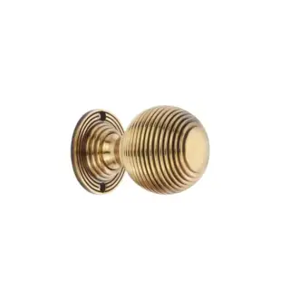 SB2133AB - Spira Brass Reeded 60mm Rim/Mortice Door Knob - Aged Brass