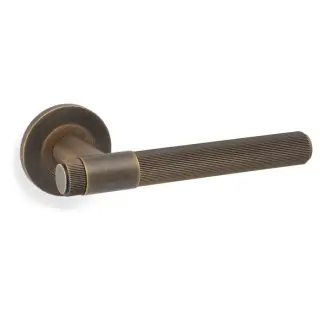 AW242AB - Alexander & Wilks Reeded Kingston Lever on Round Rose - Antique Brass