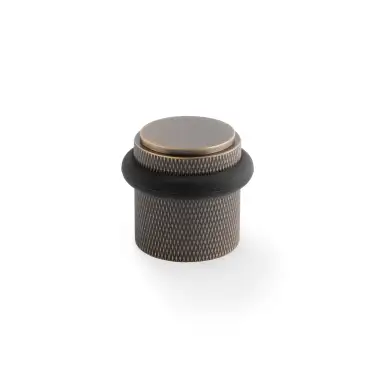 Click Here To Enlarge This Photo Of AW639KAB - Alexander & Wilks Brunel Knurled Floor Mounted Door Stop - Antique Brass